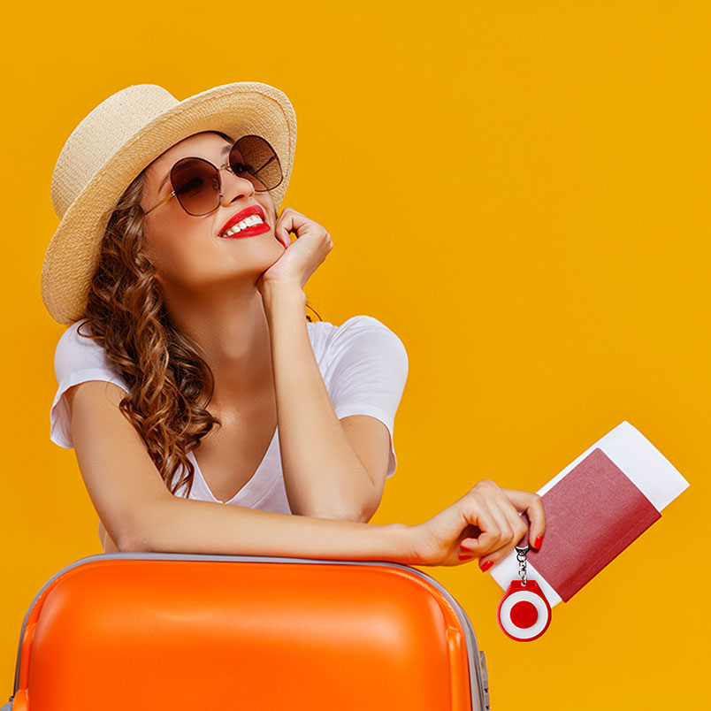 Traveller with her passport, suitcase and red TapTag